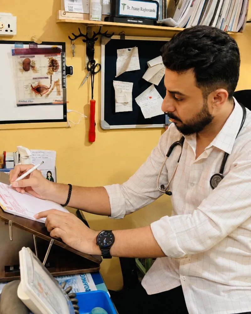 Dr. Raghuwanshi reviewing a patient record